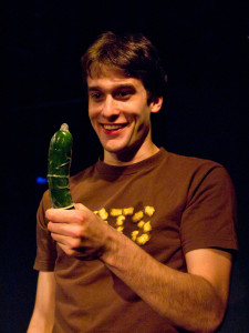 Man with zucchini and condom as seen in "The Gene Pool" at Annex Theatre, Capitol Hill, Seattle